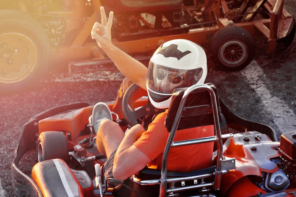 Men,Driving,Go-kart,Car,With,Speed,In,A,Playground,Racing